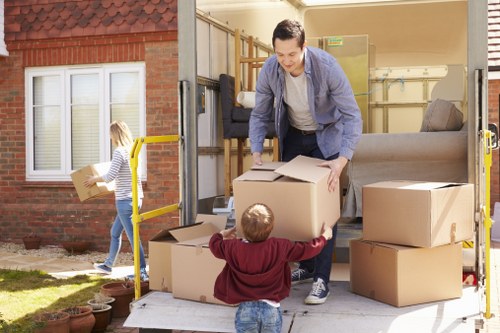 Carefully wrapped household furniture prepared for a Kensington relocation