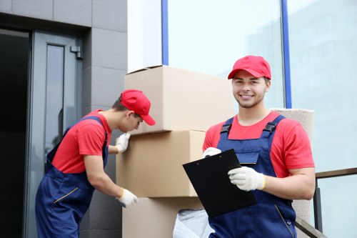 Professional team handling furniture and equipment during a Kensington office move