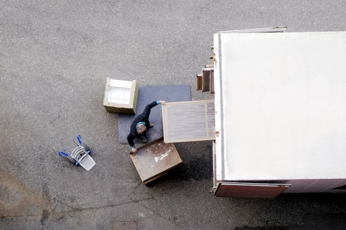 Removal team handling apartment moving equipment in Kensington