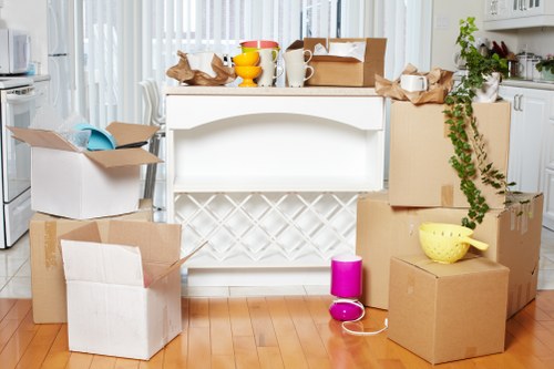 Packed boxes and furniture ready for a same day removals service in Kensington