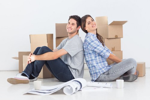 Professional movers loading a Kensington flat relocation van