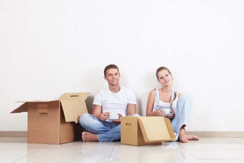 Movers loading household items carefully for a Kensington relocation