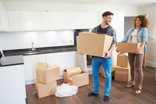 Flat moving boxes and furniture prepared for transport in Kensington