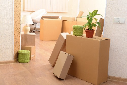 Team removing large furniture items from a Kensington flat with care
